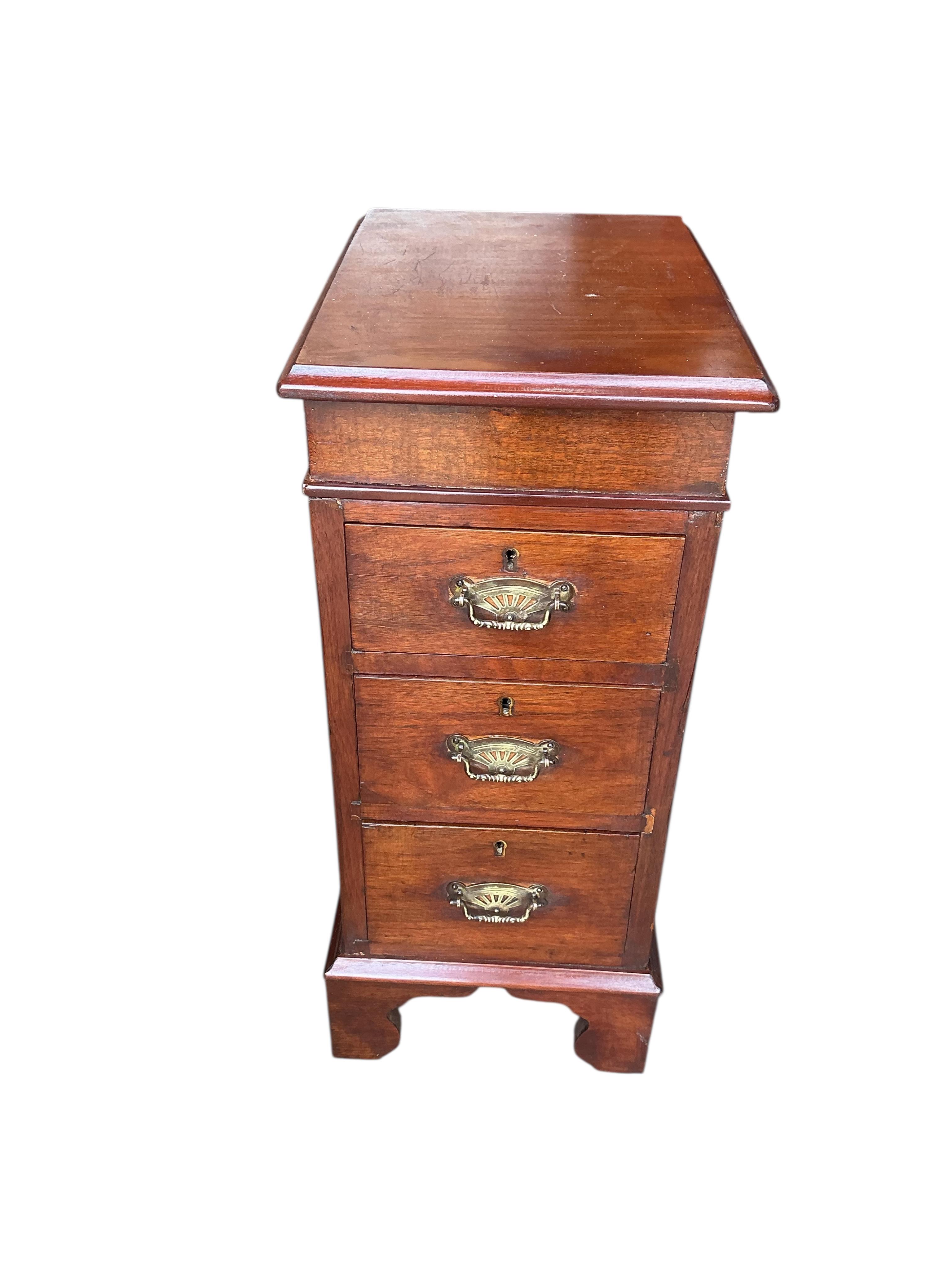 A pair of Victorian style mahogany three drawer bedside chests, width 30cm, depth 40cm, height 68cm